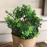 faux plant in paper pot